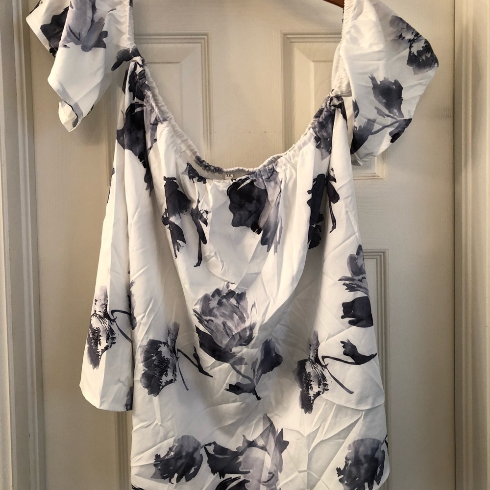 White shirt with black flowers. Off the shoulder.